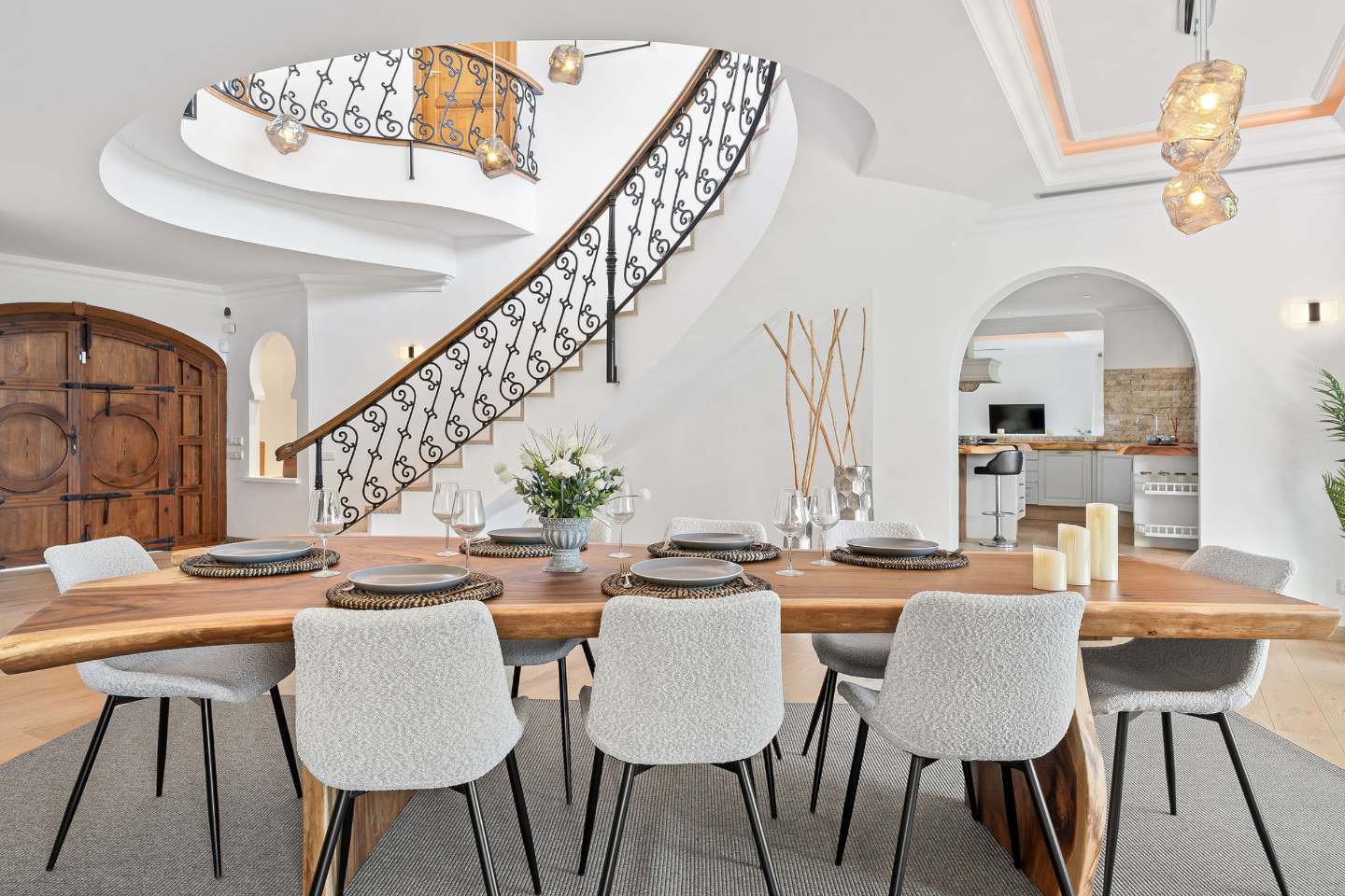 Elegant dining room in an authentic Andalusian villa with breathtaking sea views, featuring traditional Andalusian design elements, a large dining table, and expansive windows that offer stunning ocean vistas, creating a perfect setting for formal dining and entertaining.