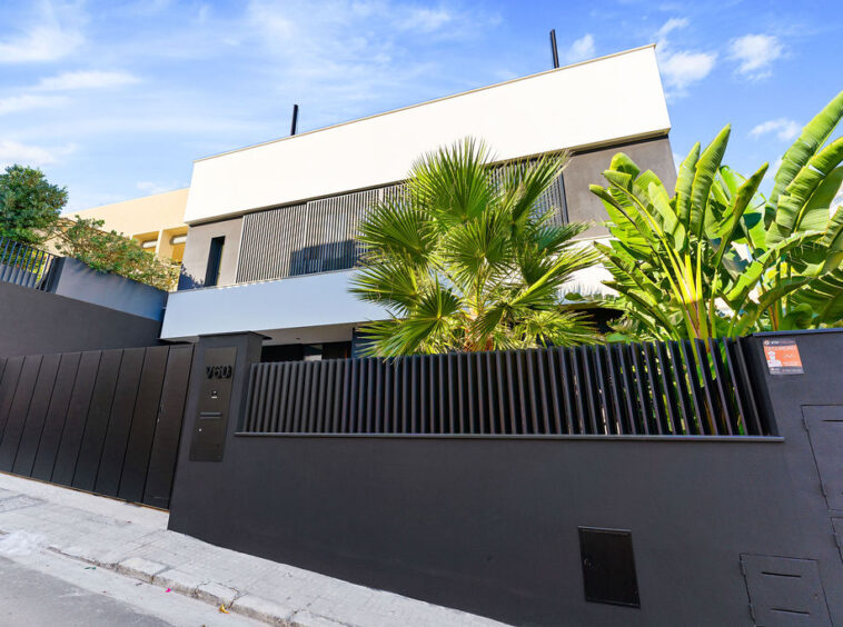 Impressive facade of an elevated sea view villa in Palma de Mallorca, showcasing contemporary architecture and stunning coastal surroundings.