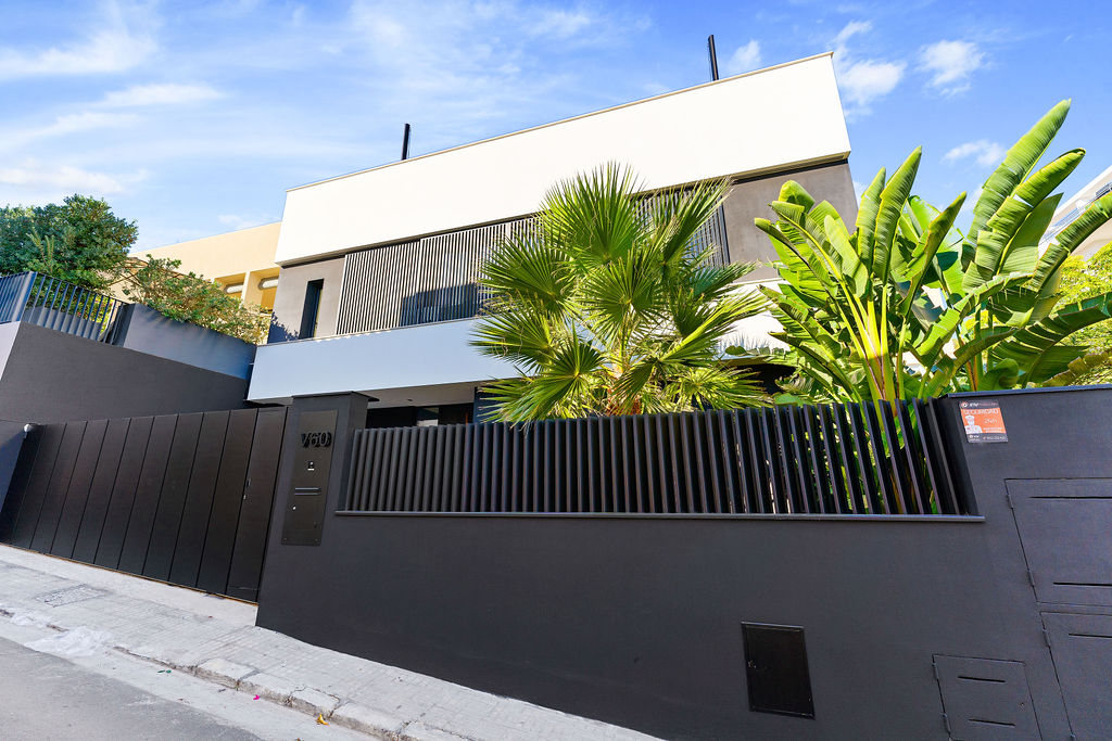 Impressive facade of an elevated sea view villa in Palma de Mallorca, showcasing contemporary architecture and stunning coastal surroundings.