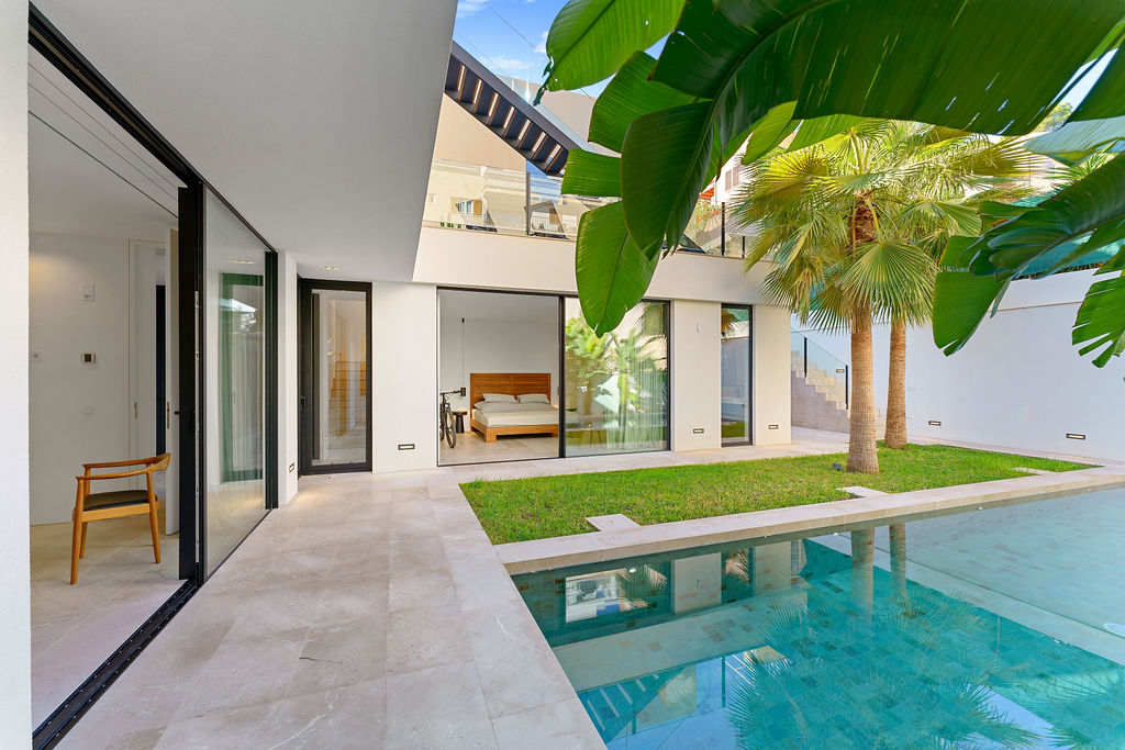 Stunning pool and terrace at an elevated sea view villa in Palma de Mallorca, featuring luxurious outdoor seating and breathtaking ocean vistas.