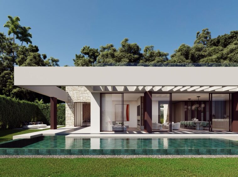 Impressive facade of a frontline golf villa in Marbella, featuring sleek modern architecture, expansive windows, and a spacious design that seamlessly blends with the lush surroundings of the golf course, showcasing luxury living at its finest.