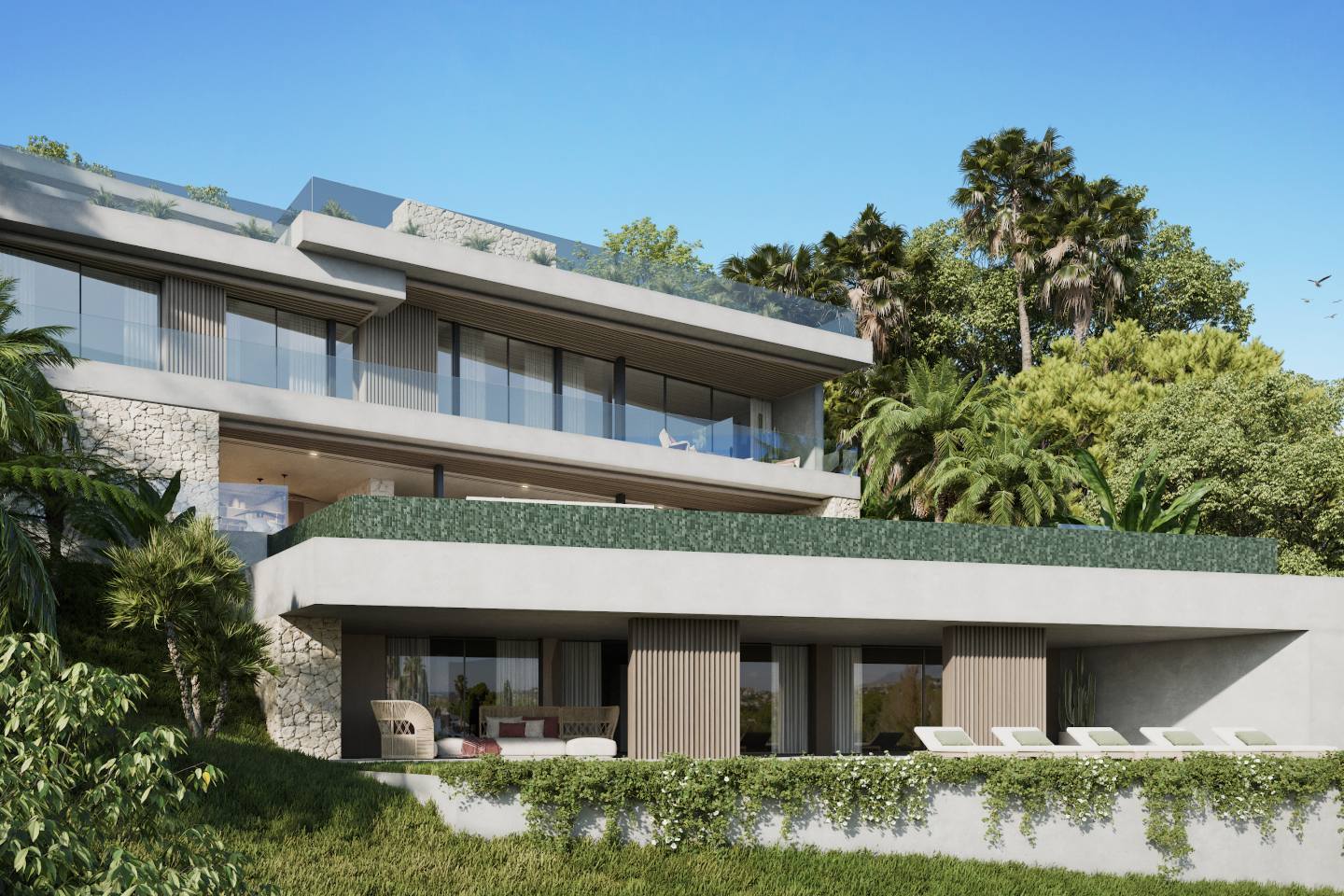 Elegant modern villa in El Herrojo, Benahavís, featuring a sleek white facade with clean architectural lines, large floor-to-ceiling windows, and warm ambient lighting. The property is surrounded by lush greenery and offers a spacious outdoor area, blending contemporary luxury with natural beauty.