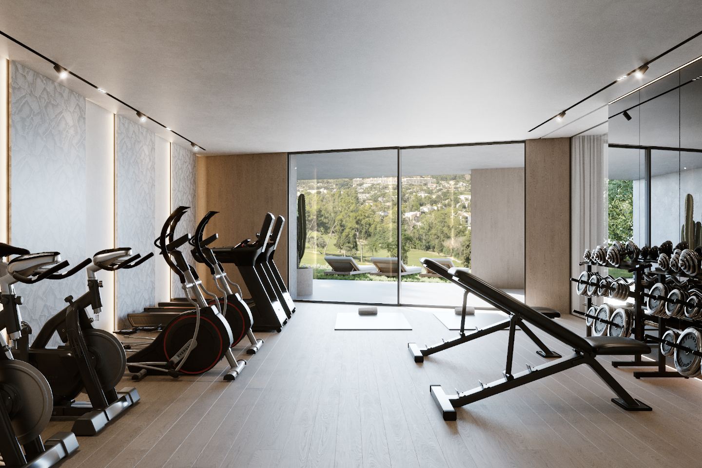 State-of-the-art gym in a new build villa in El Herrojo, Benahavis, featuring modern fitness equipment, spacious interiors, and large windows that offer scenic views of the surrounding nature. The gym provides a luxurious and motivating space for fitness and wellness.