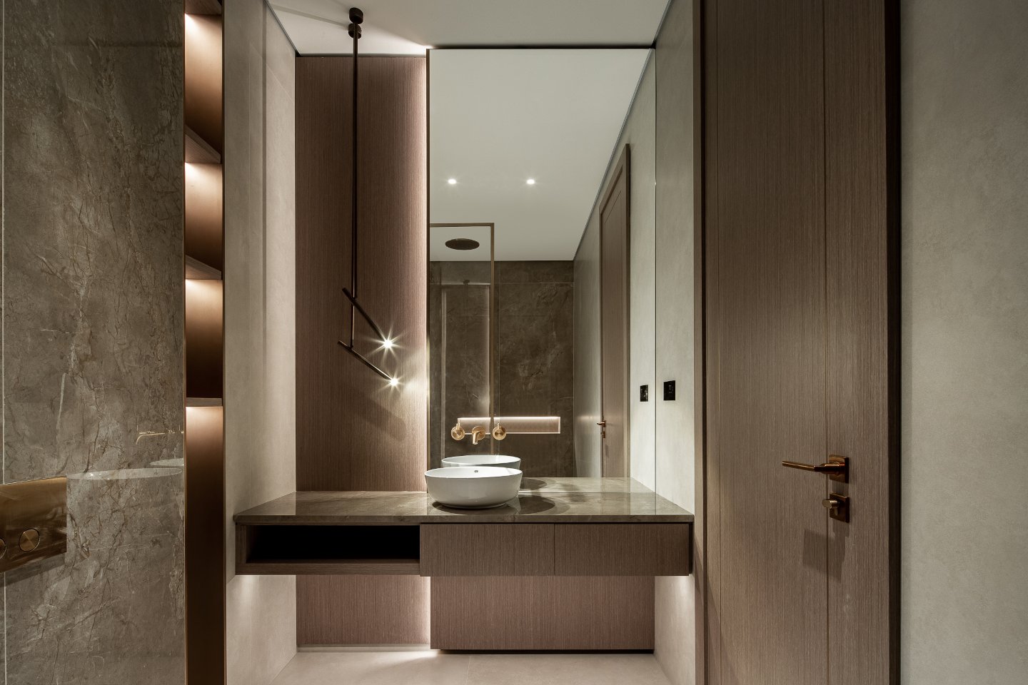 Elegant bathroom in an ultra-luxury mansion in Emirates Hills, featuring a freestanding bathtub, sleek marble finishes, and large windows offering stunning skyline views. The space is designed with modern fixtures, soft ambient lighting, and a serene, spa-like ambiance.