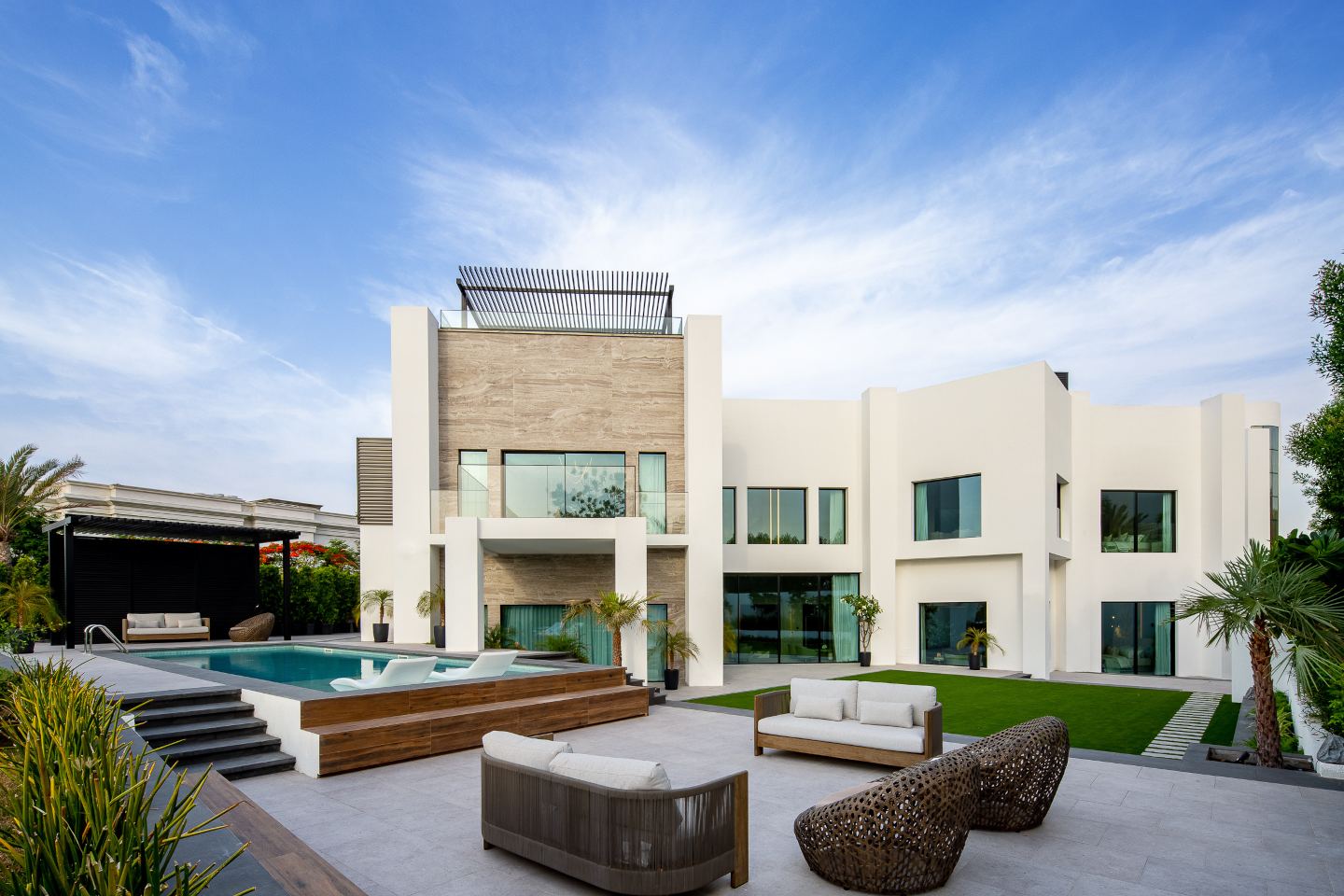 Stunning facade of an ultra-luxury mansion in Emirates Hills, showcasing elegant architecture and breathtaking skyline views